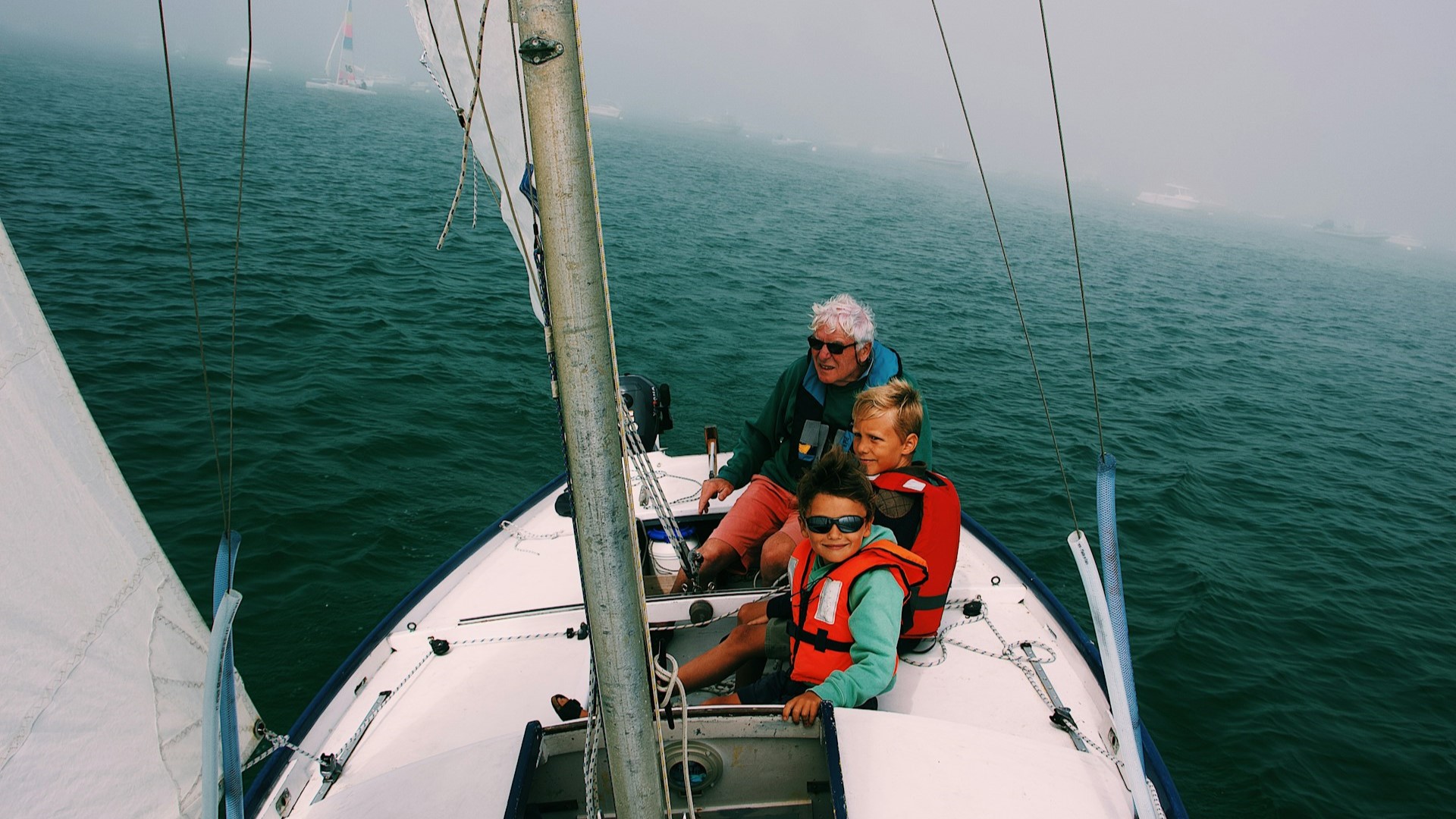 kids sailing storm